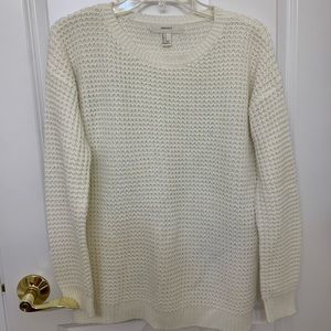 Off-white/light cream colored sweater. Not itchy!